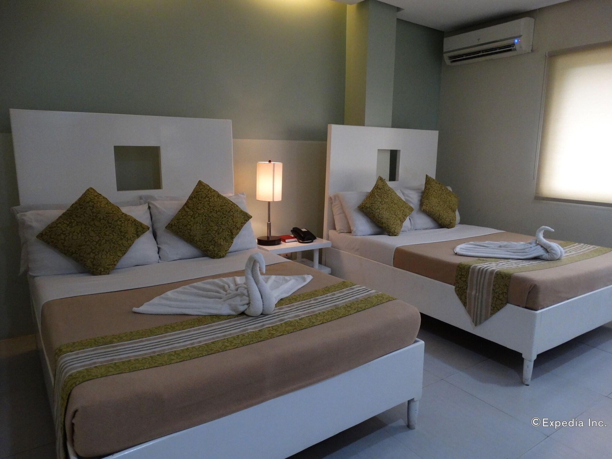 Empire Suites Hotel Puerto Princesa Bagian luar foto