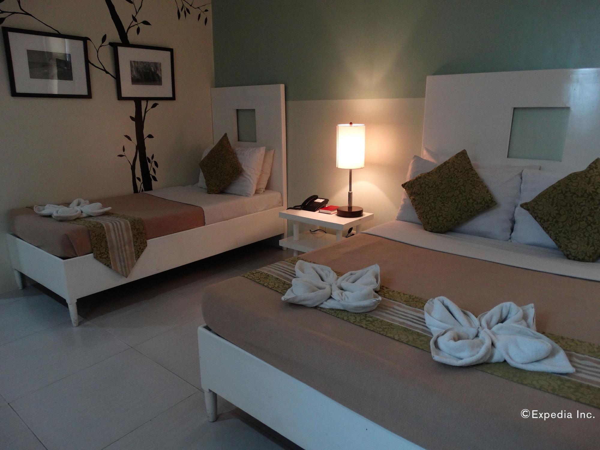 Empire Suites Hotel Puerto Princesa Bagian luar foto