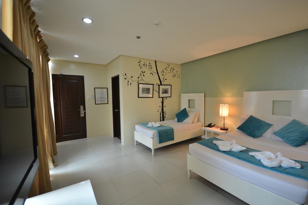 Empire Suites Hotel Puerto Princesa Bagian luar foto
