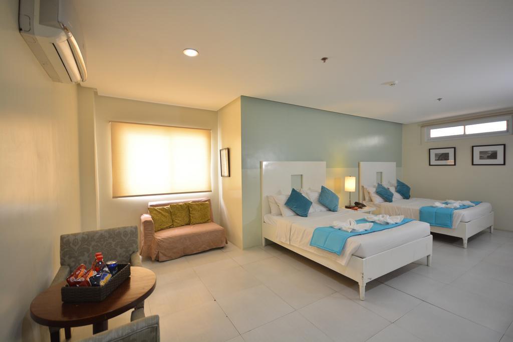 Empire Suites Hotel Puerto Princesa Bagian luar foto